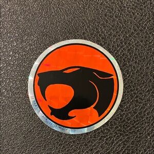 Vintage Panther Logo Sticker — Black & Orange Round Decal Thundercat